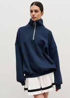 Erica – Sweter damski oversize z zamkiem pod szyją