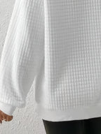 Krótki sweter damski z zamkiem pod szyją
